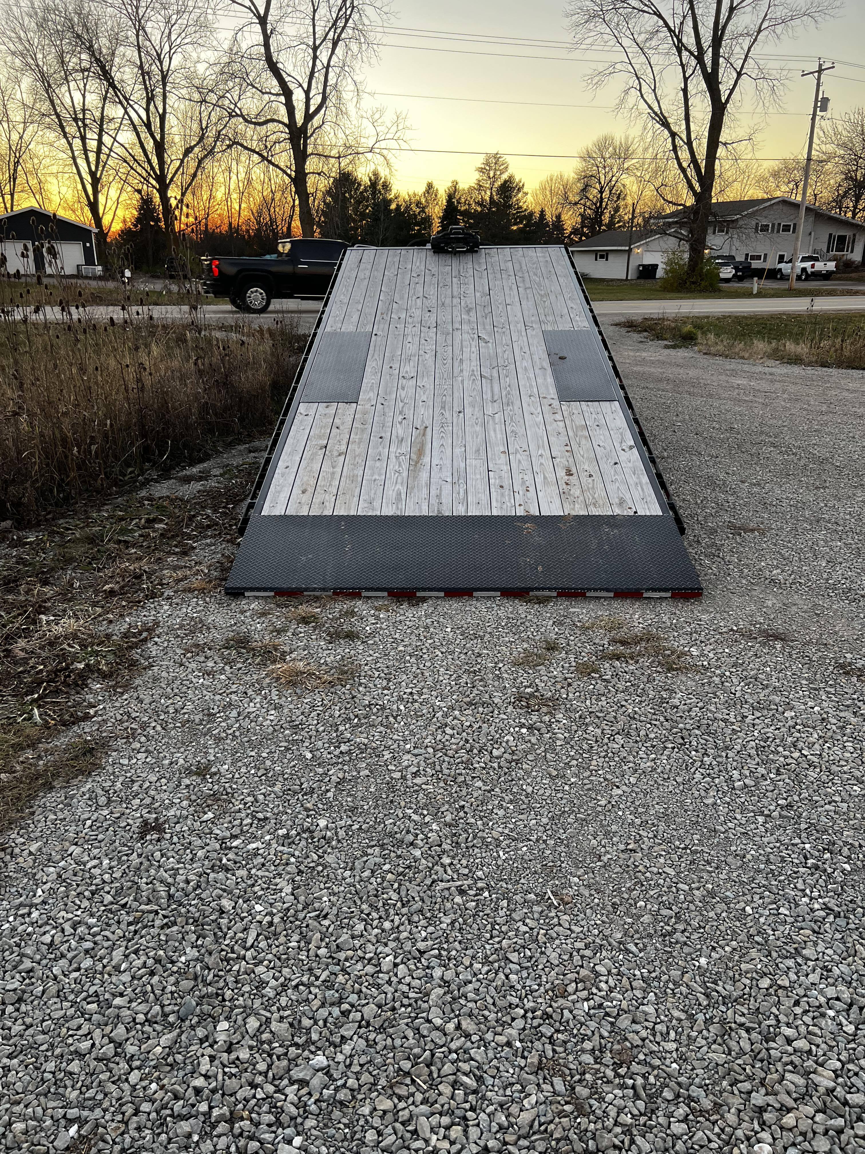 22ft Deckover Tilt Trailer for rent in Oshkosh Wisconsin - Brand new 2025 PJ Trailers deck-over tilt trailer perfect for transporting vehicles, equipment, machinery, and heavy cargo. The hydraulic tilt-bed makes loading effortless.