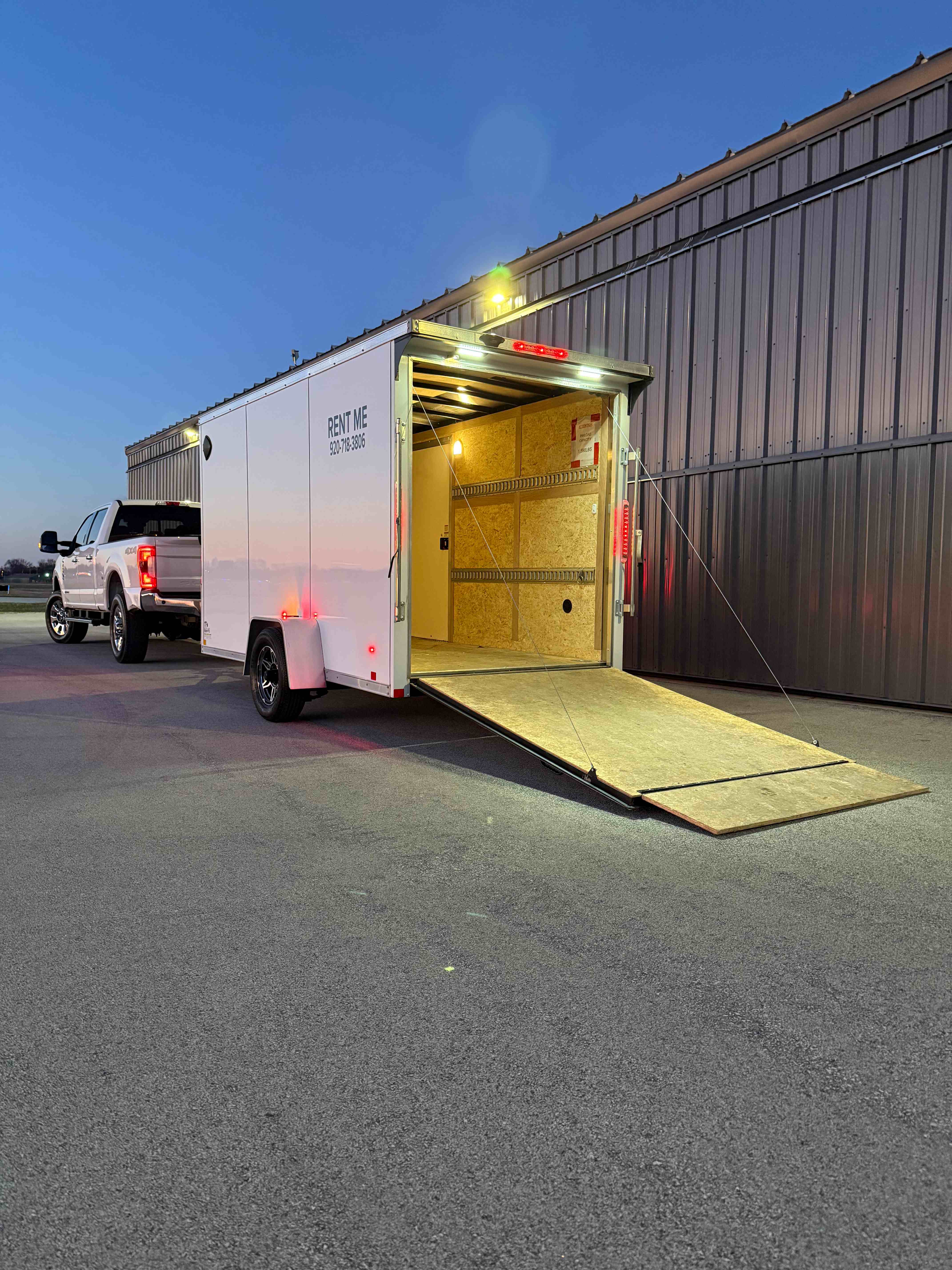 6x12 Enclosed Trailer for rent in Oshkosh Wisconsin - Compact and versatile enclosed trailer perfect for moving, small equipment transport, and secure cargo hauling. E-track system allows flexible tie-down options.